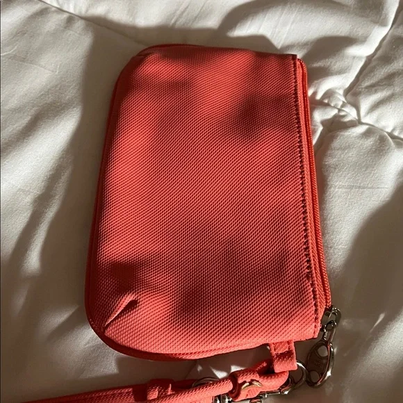 Coral color Lacoste Women's Vibrant Coral Wristlet - Picture 5 of 5